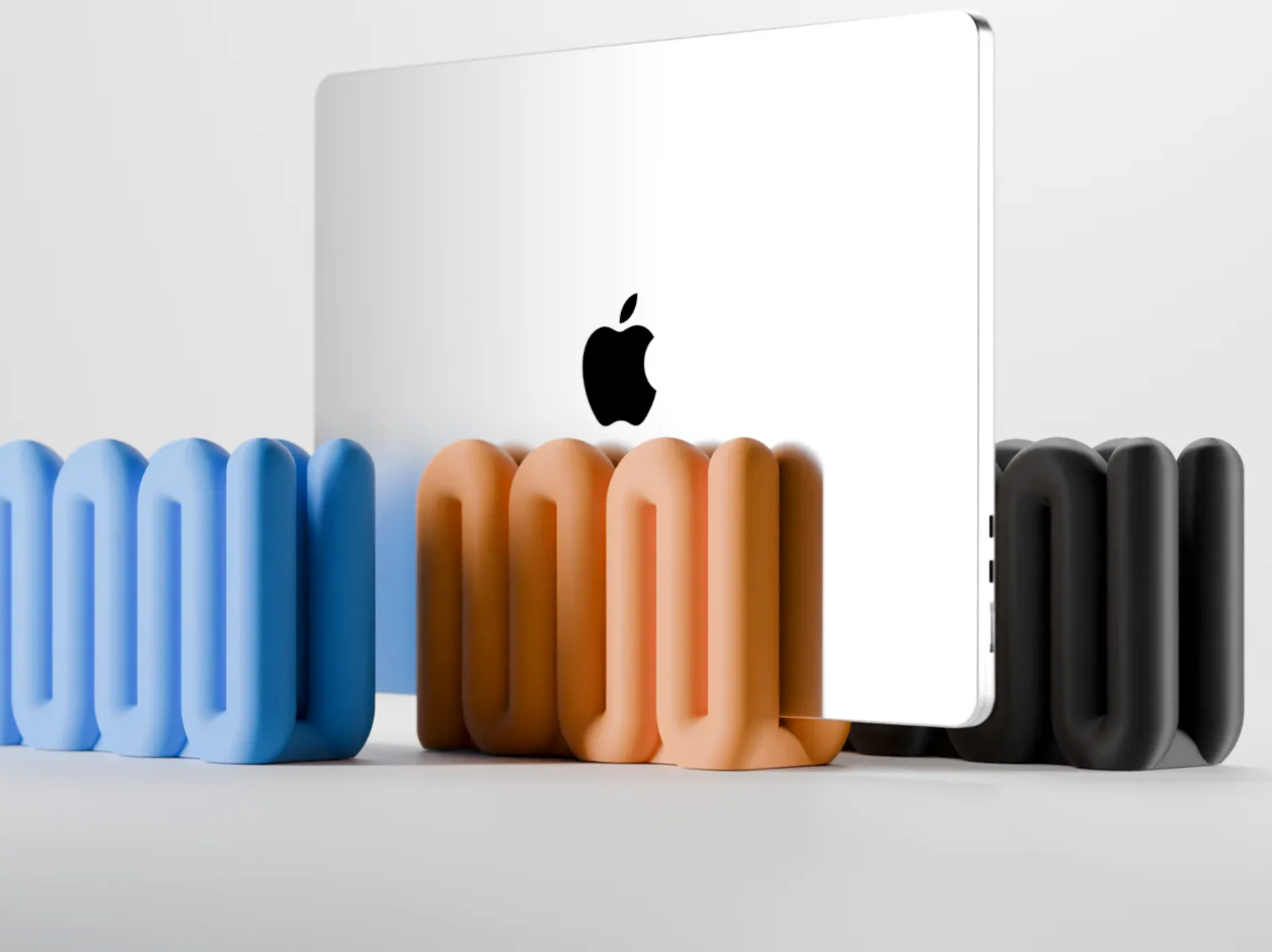 Apple MacBook placed in Wibble Aesthetic Vertical Laptop Stand by TREEDKW