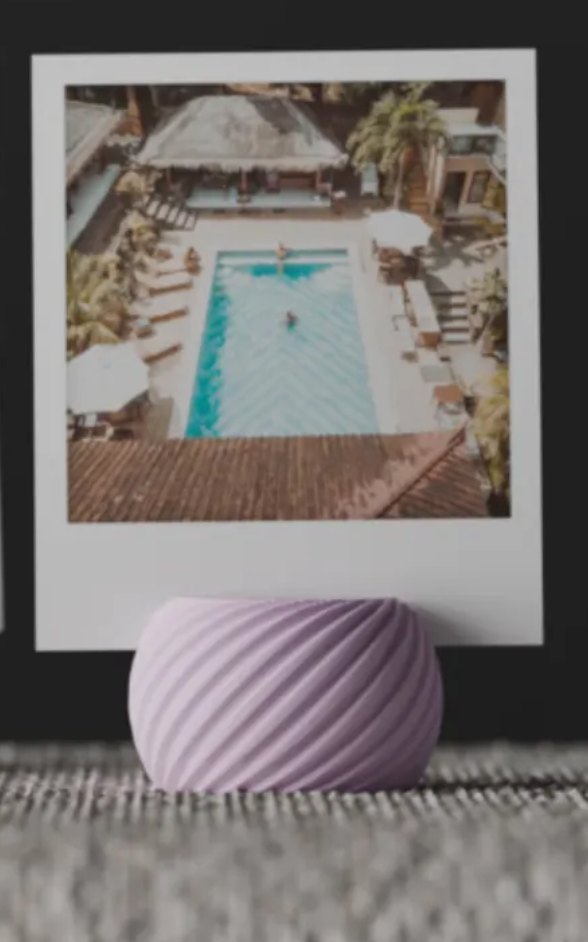 Modern Twisted Spiral Photo Holder on tabletop