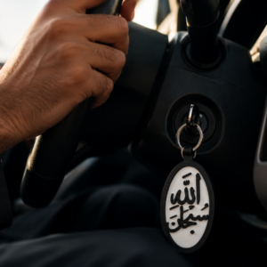 Subhanallah Islamic Arabic calligraphy keychain attached to car key in ignition